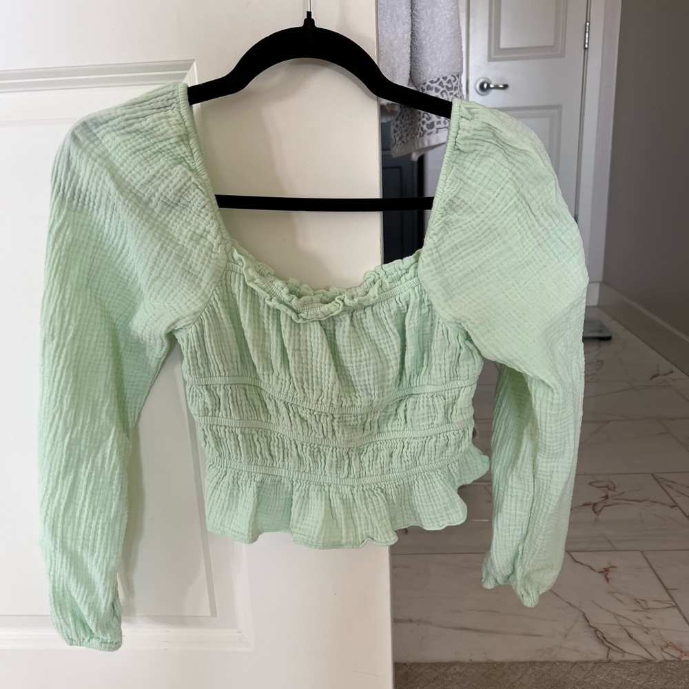 Long sleeve green ruffle top